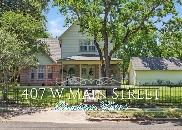 407 W Main St, Brenham, TX 77833 - view of front of property with brick siding and a shingled roof