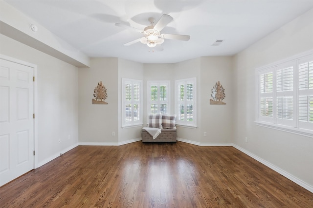 407 W Main St, Brenham, TX 77833 - unfurnished room featuring healthy amount of natural light, a ceiling fan, wood finished floors, and baseboards
