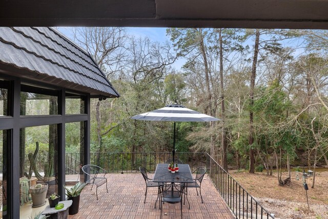 827 Magnolia St, Livingston, TX 77351 - view of patio featuring outdoor dining area