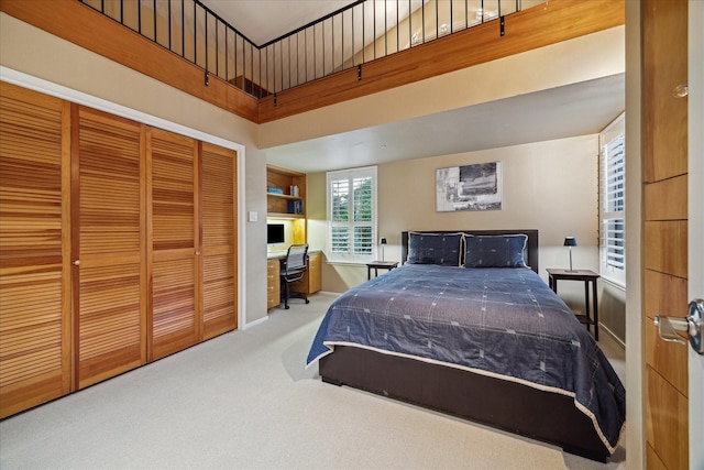 bedroom with carpet flooring, a closet, and a towering ceiling