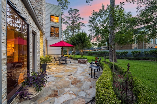 patio terrace at dusk with outdoor dining area