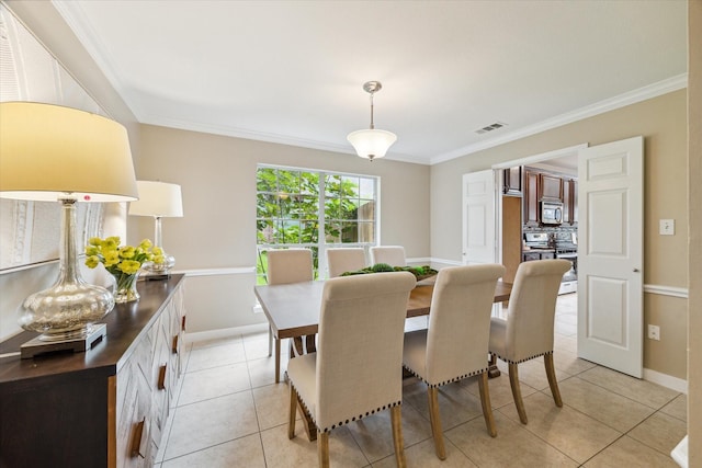 17426 Little Riata Dr, Houston, TX 77095 - dining room with crown molding, light tile patterned flooring, and baseboards