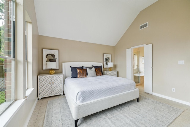 17426 Little Riata Dr, Houston, TX 77095 - bedroom featuring tile patterned floors, high vaulted ceiling, connected bathroom, and baseboards