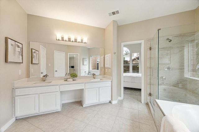 17426 Little Riata Dr, Houston, TX 77095 - ensuite bathroom with a stall shower, tile patterned flooring, double vanity, a tub to relax in, and baseboards