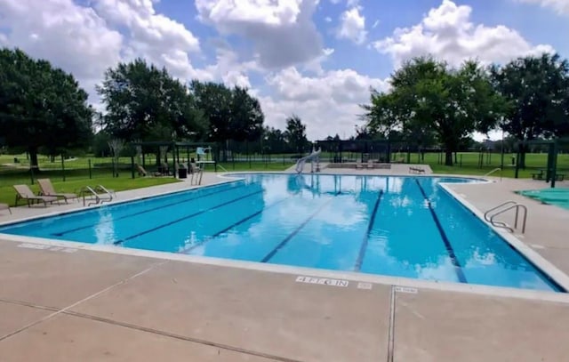 17426 Little Riata Dr, Houston, TX 77095 - community pool featuring a patio