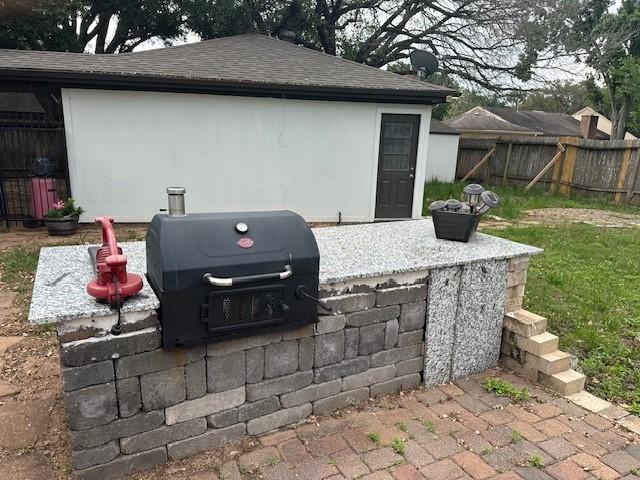 entry to storm shelter with fence