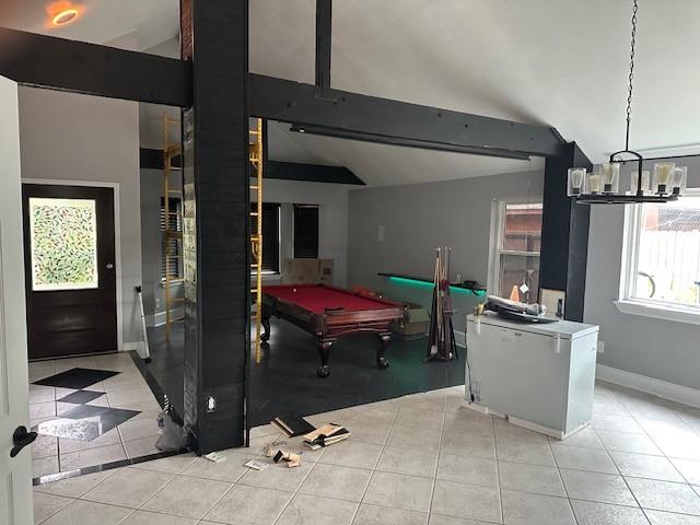 rec room with light tile patterned flooring, a chandelier, lofted ceiling, billiards, and baseboards