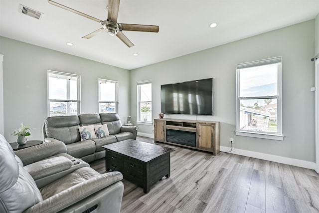 16631 Jean Lafitte Rd, Galveston, TX 77554 - living room with a ceiling fan, light wood-style flooring, baseboards, and recessed lighting