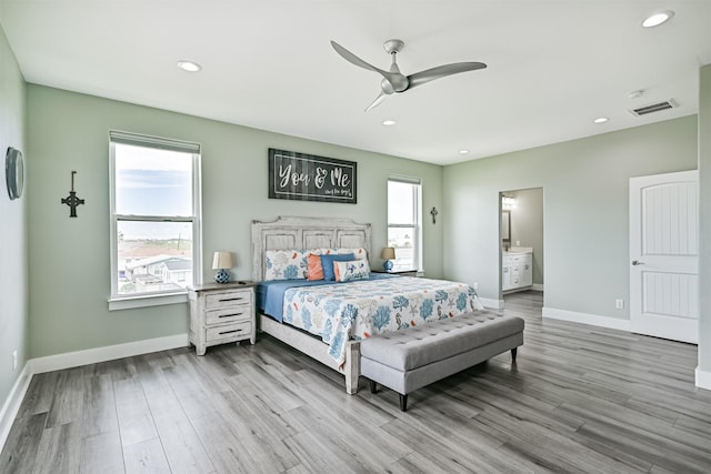 16631 Jean Lafitte Rd, Galveston, TX 77554 - bedroom featuring baseboards, wood finished floors, recessed lighting, connected bathroom, and ceiling fan