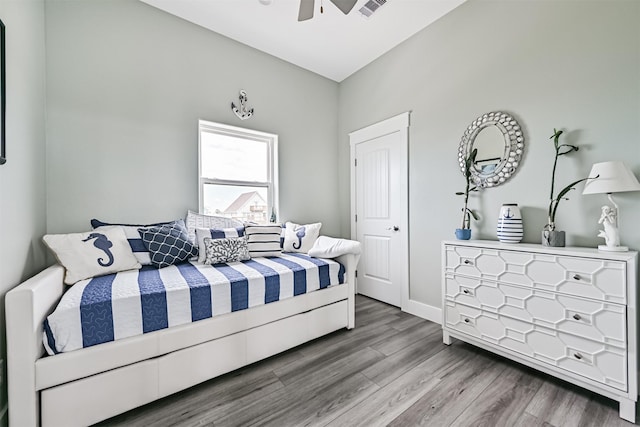 16631 Jean Lafitte Rd, Galveston, TX 77554 - bedroom featuring wood finished floors, a ceiling fan, and baseboards
