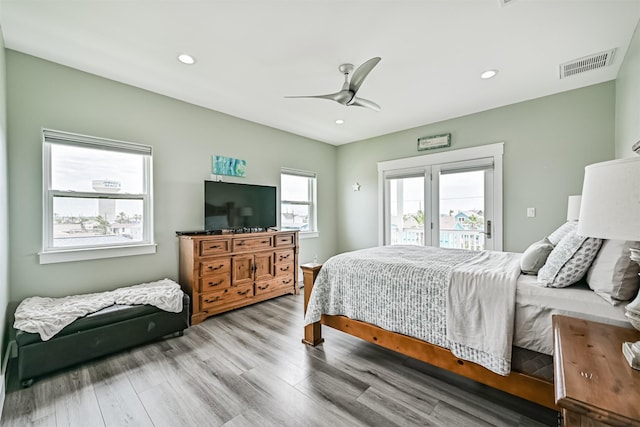 16631 Jean Lafitte Rd, Galveston, TX 77554 - bedroom with access to outside, wood finished floors, recessed lighting, and a ceiling fan