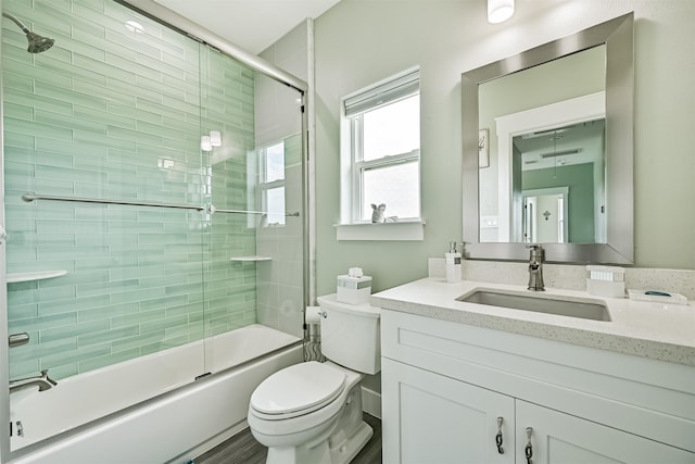 16631 Jean Lafitte Rd, Galveston, TX 77554 - full bathroom featuring toilet, shower / bath combination with glass door, and vanity