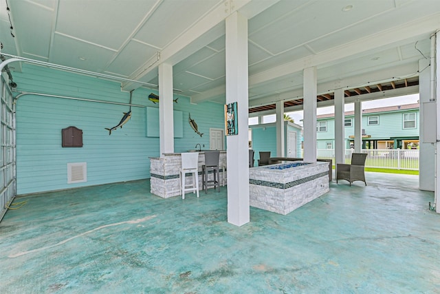 16631 Jean Lafitte Rd, Galveston, TX 77554 - view of patio featuring a fire pit and fence