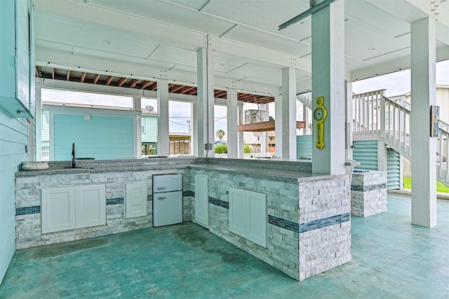 16631 Jean Lafitte Rd, Galveston, TX 77554 - view of patio featuring exterior kitchen and stairs
