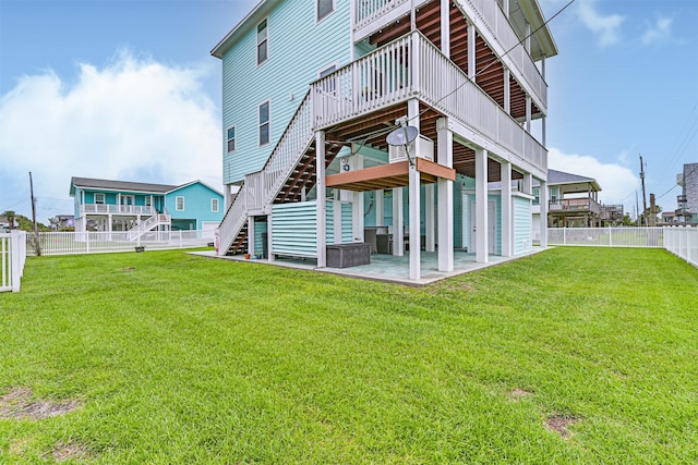 16631 Jean Lafitte Rd, Galveston, TX 77554 - rear view of house featuring stairs, a deck, and a patio