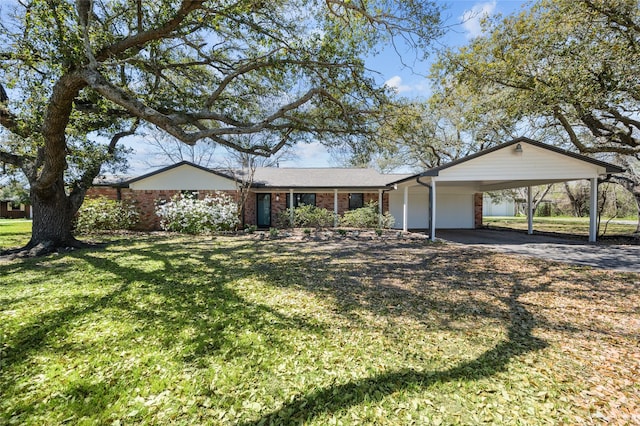 6211 Sjolander Rd, Baytown, TX 77521 - view of front of property with a carport, a front yard, driveway, and brick siding