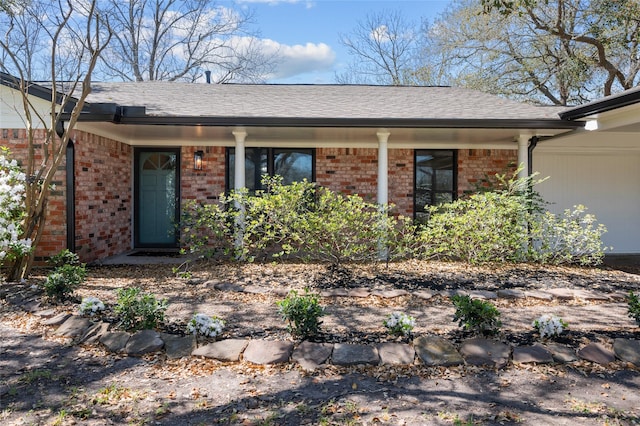 6211 Sjolander Rd, Baytown, TX 77521 - view of front of home with brick siding and a shingled roof