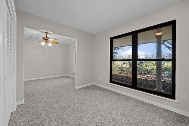 6211 Sjolander Rd, Baytown, TX 77521 - spare room with carpet flooring, a ceiling fan, and baseboards