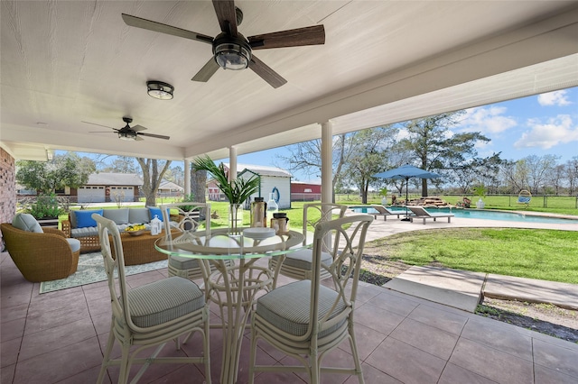 6211 Sjolander Rd, Baytown, TX 77521 - view of patio featuring ceiling fan, an outdoor hangout area, an outdoor pool, and outdoor dining space