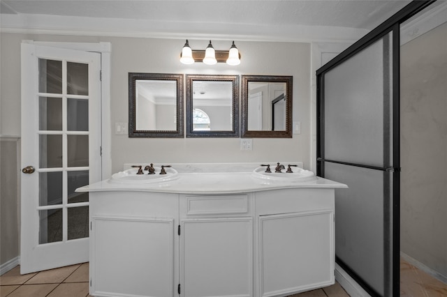 6211 Sjolander Rd, Baytown, TX 77521 - full bathroom with double vanity and tile patterned floors