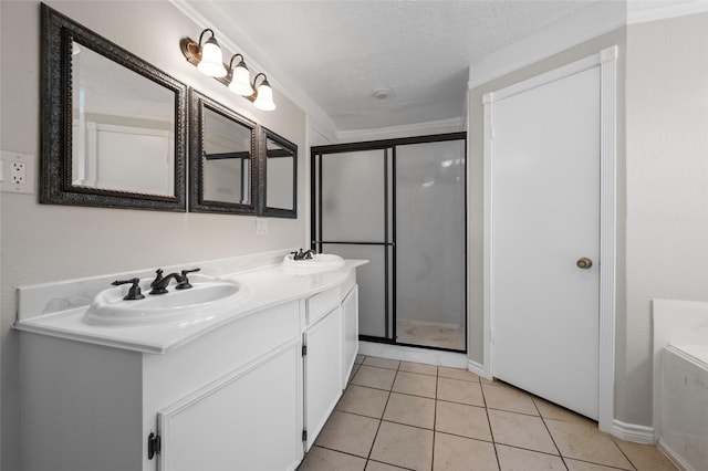 6211 Sjolander Rd, Baytown, TX 77521 - bathroom featuring a stall shower, double vanity, and tile patterned floors