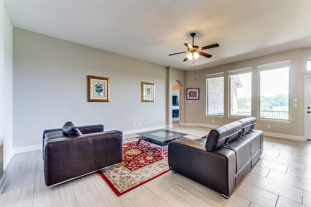 27314 Dana Crk, Boerne, TX 78015 - living room with ceiling fan, arched walkways, and baseboards