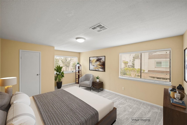 1829 Augusta Dr Unit 33, Houston, TX 77057 - carpeted bedroom featuring baseboards and a textured ceiling