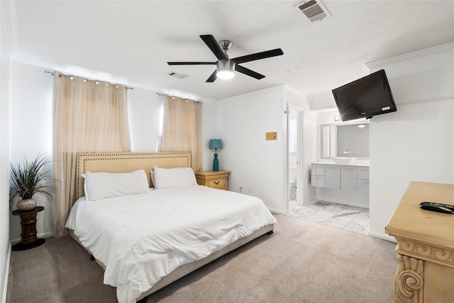 bedroom featuring crown molding, marble finish flooring, connected bathroom, ceiling fan, and baseboards