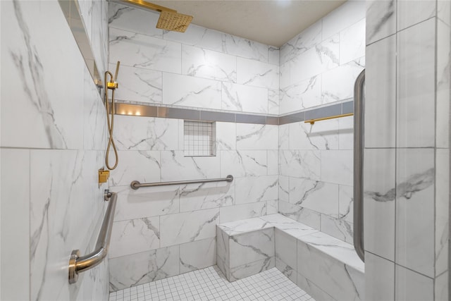 bathroom with a tile shower