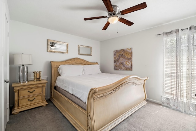 carpeted bedroom with baseboards and a ceiling fan