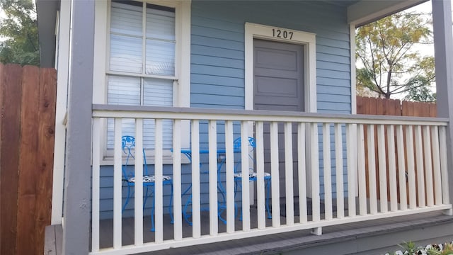 1207 29th St, Galveston, TX 77550 - view of exterior entry with covered porch and fence