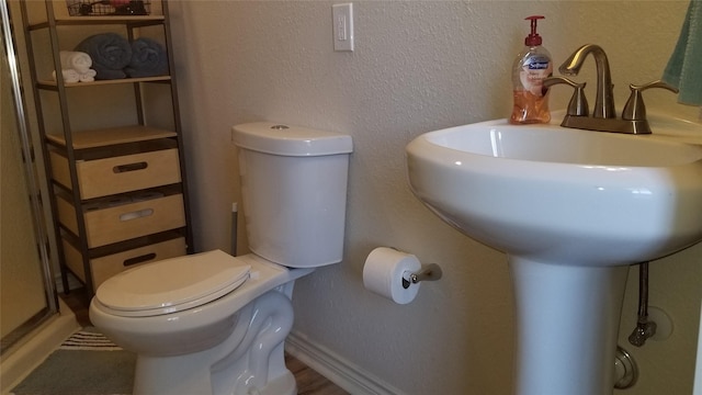1207 29th St, Galveston, TX 77550 - bathroom featuring toilet and baseboards