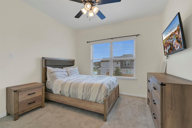 15606 Upper Lochton Dr, Humble, TX 77346 - bedroom with light colored carpet, baseboards, and a ceiling fan