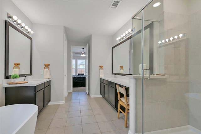 15606 Upper Lochton Dr, Humble, TX 77346 - ensuite bathroom with a shower stall, tile patterned flooring, ceiling fan, and a soaking tub