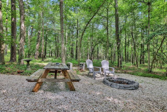 275 Fairview E, Livingston, TX 77351 - view of yard with a fire pit and a view of trees