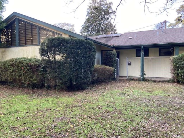 3755 Long Ave, Beaumont, TX 77706 - view of side of home with roof with shingles