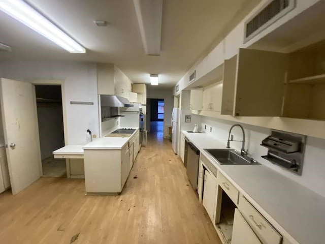 3755 Long Ave, Beaumont, TX 77706 - kitchen with a sink, light wood-type flooring, appliances with stainless steel finishes, white cabinetry, and light countertops