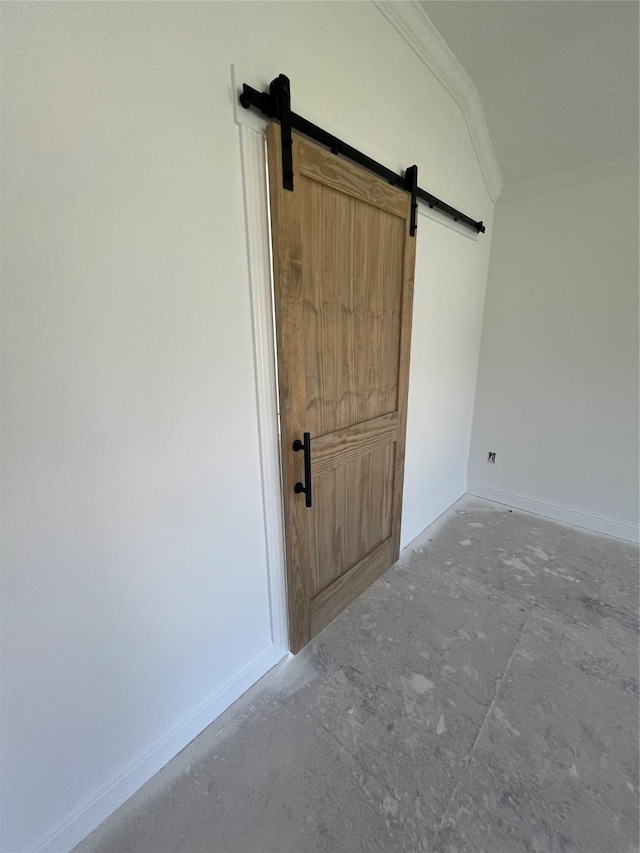 118 Capetown, Conroe, TX 77356 - detailed view of ornamental molding, a barn door, and baseboards