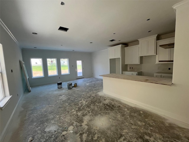 118 Capetown, Conroe, TX 77356 - kitchen with white cabinets and baseboards