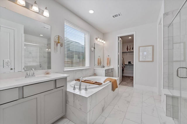 10059 Preserve Way, Conroe, TX 77385 - full bathroom with a stall shower, a garden tub, marble look tiles, a spacious closet, and two vanities
