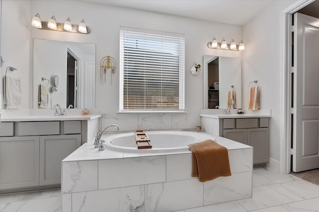10059 Preserve Way, Conroe, TX 77385 - bathroom with marble finish flooring, a garden tub, and two vanities