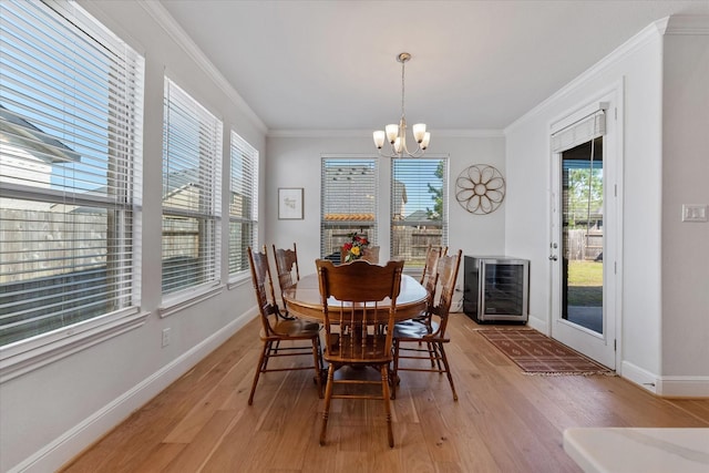 10059 Preserve Way, Conroe, TX 77385 - dining room with plenty of natural light, light wood-type flooring, a chandelier, baseboards, and ornamental molding