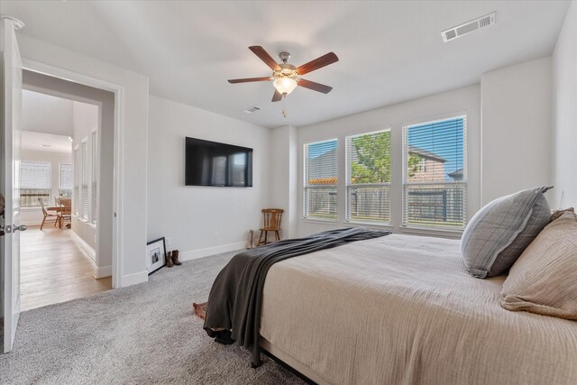 10059 Preserve Way, Conroe, TX 77385 - bedroom with carpet floors, baseboards, and a ceiling fan