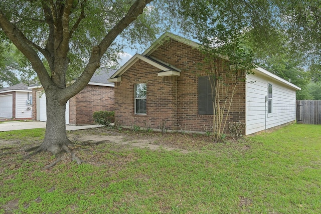 view of front facade featuring brick siding and concrete driveway