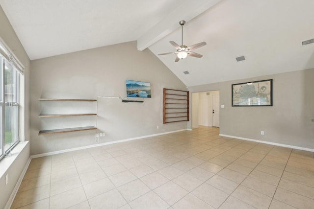 empty room with a ceiling fan, healthy amount of natural light, light tile patterned flooring, and baseboards