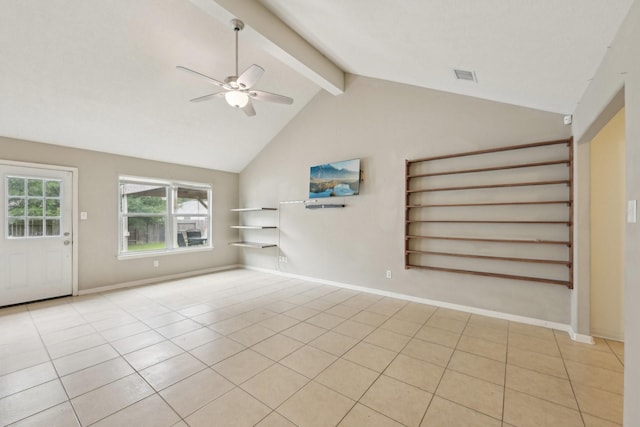 unfurnished living room with ceiling fan, beamed ceiling, light tile patterned flooring, high vaulted ceiling, and baseboards
