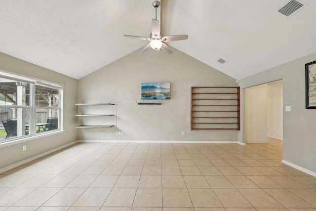unfurnished living room featuring ceiling fan, lofted ceiling, light tile patterned floors, and baseboards