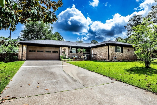 229 Willowbend St, Huntsville, TX 77320 - single story home featuring brick siding, a garage, driveway, and a front lawn