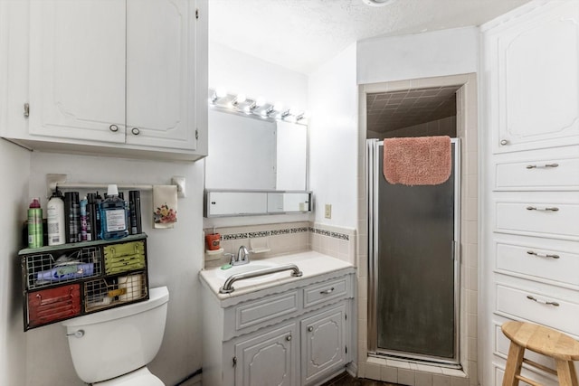 229 Willowbend St, Huntsville, TX 77320 - bathroom featuring a stall shower, toilet, and vanity