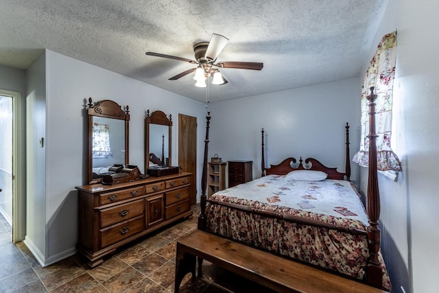 229 Willowbend St, Huntsville, TX 77320 - bedroom with multiple windows, a textured ceiling, baseboards, and a ceiling fan